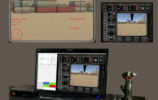 A laptop and remote control on a desk.