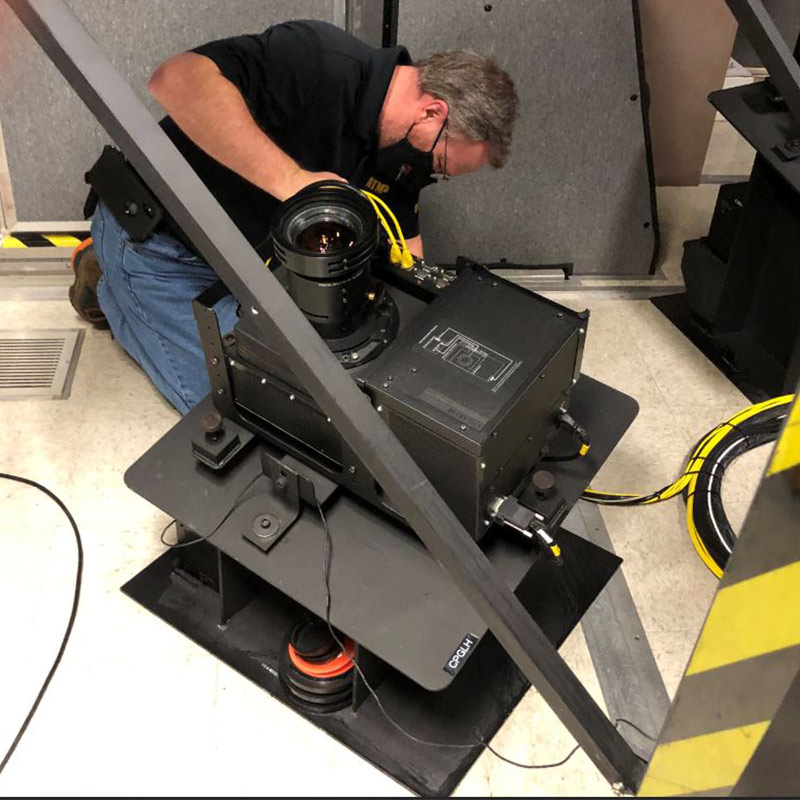 A man working on an electrical box.